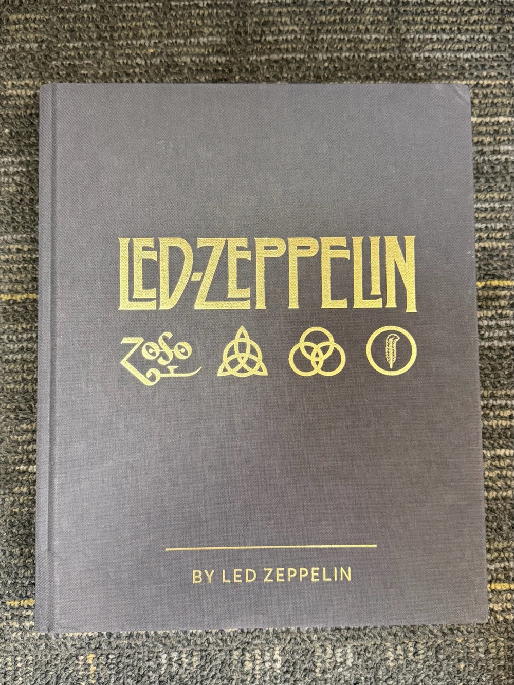 Led Zeppelin by Led Zeppelin hardcover collectible book.